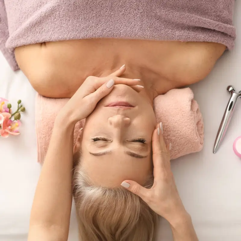 Client relaxing during a facial treatment